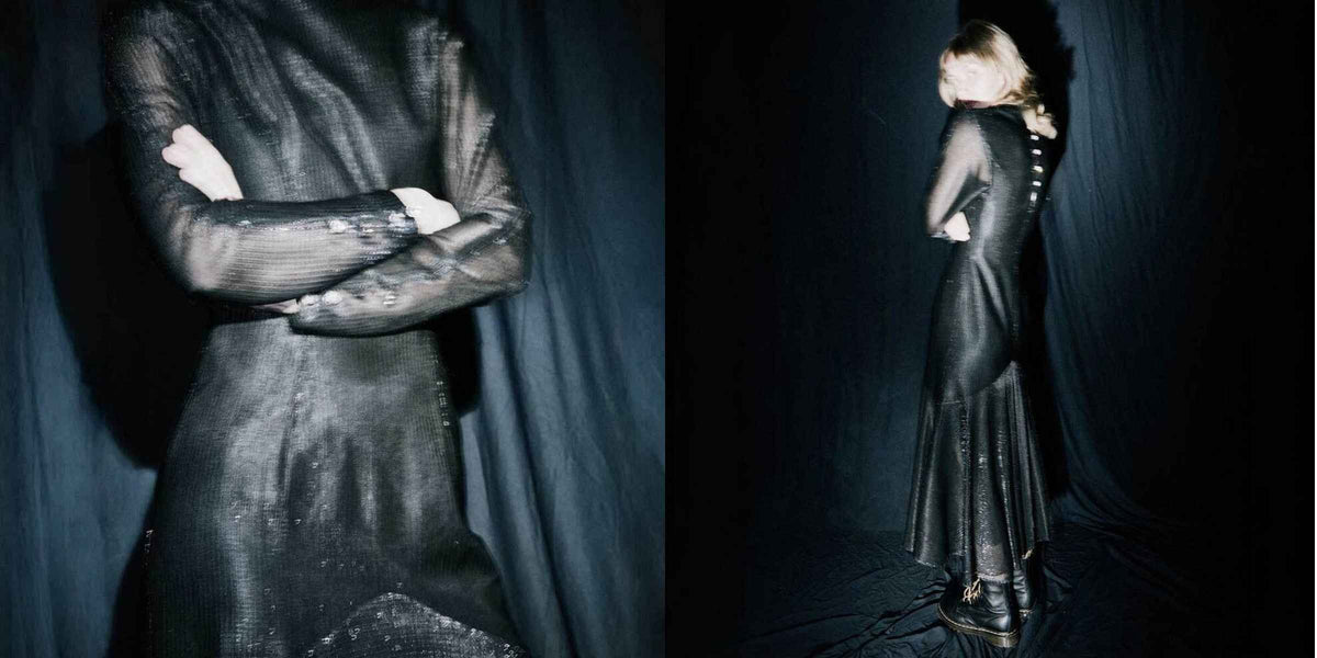 A model wearing a long-sleeved black textured dress, shown in a split-screen view with a front three-quarter close-up on the left and a full side profile on the right, set against a dark draped studio backdrop.