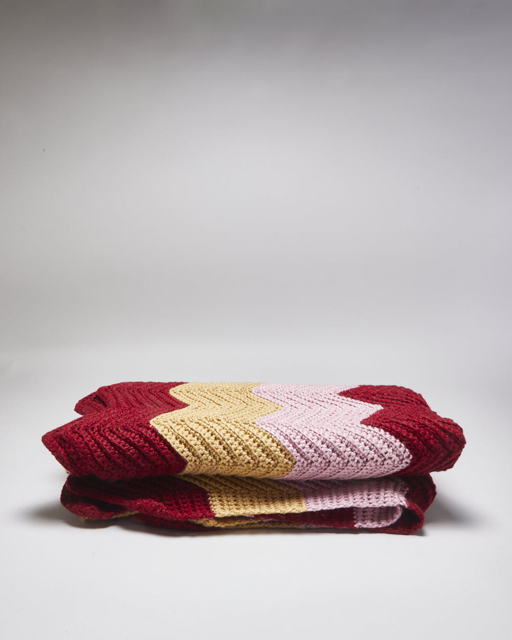 Handknitted Pink And Burgundy Throw