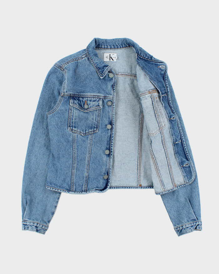 Vintage 1990s Calvin Klein Women's Medium Wash Cropped Denim Jacket - L