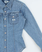 Vintage 1990s Calvin Klein Women's Light Wash Denim Snap Button Long Sleeve Shirt - S