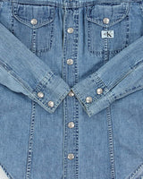 Vintage 1990s Calvin Klein Women's Light Wash Denim Snap Button Long Sleeve Shirt - S