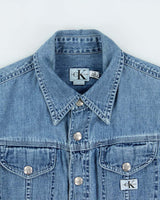 Vintage 1990s Calvin Klein Women's Light Wash Denim Snap Button Long Sleeve Shirt - S