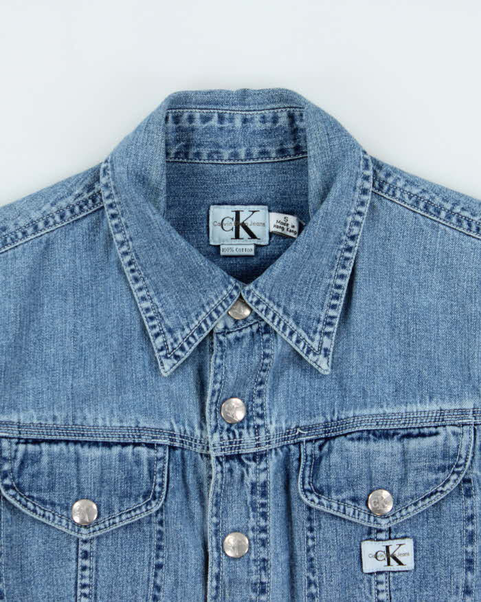 Vintage 1990s Calvin Klein Women's Light Wash Denim Snap Button Long Sleeve Shirt - S